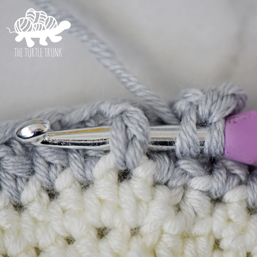 Photo shows a front post double crochet stitch.