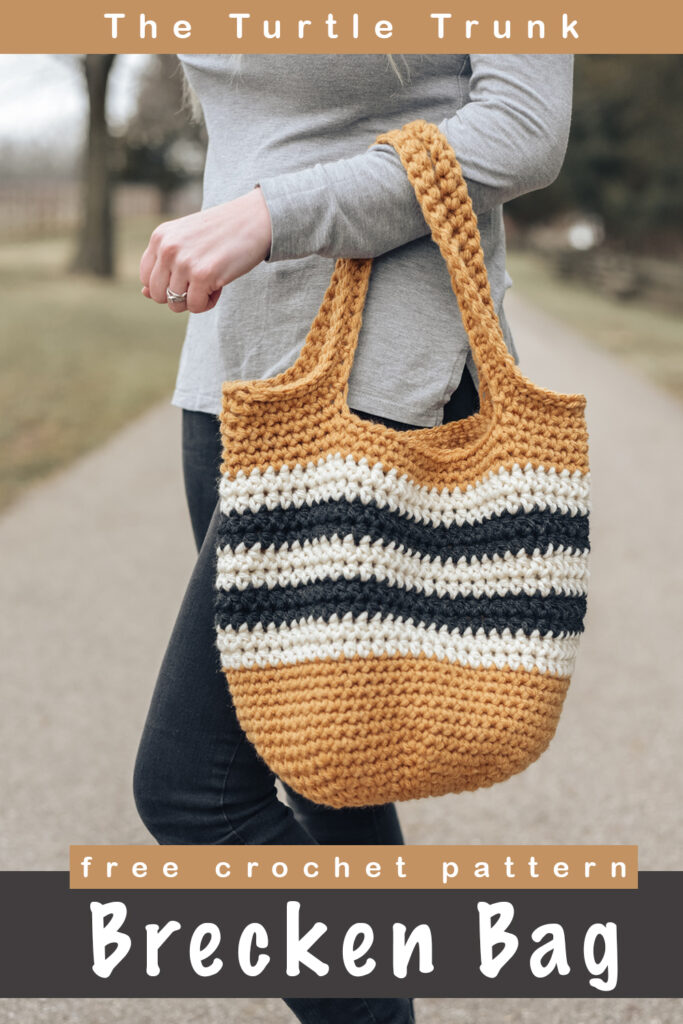 Pinterest pin for the Brecken Bag crochet pattern by The Turtle Trunk. Photo shows a women holding a yellow, white, and black crochet tote bag outside.