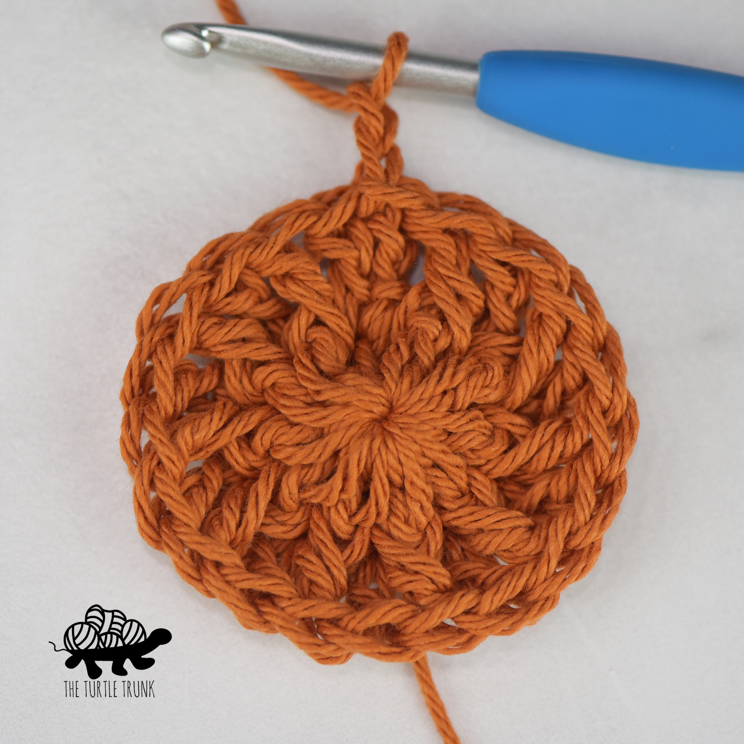 Round 2 of the Hello Sunshine Coaster crochet pattern by The Turtle Trunk.