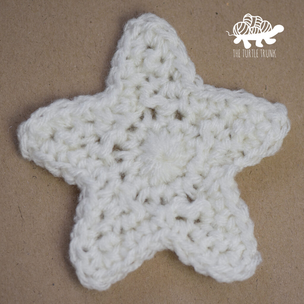 Photo of a white, crochet star.