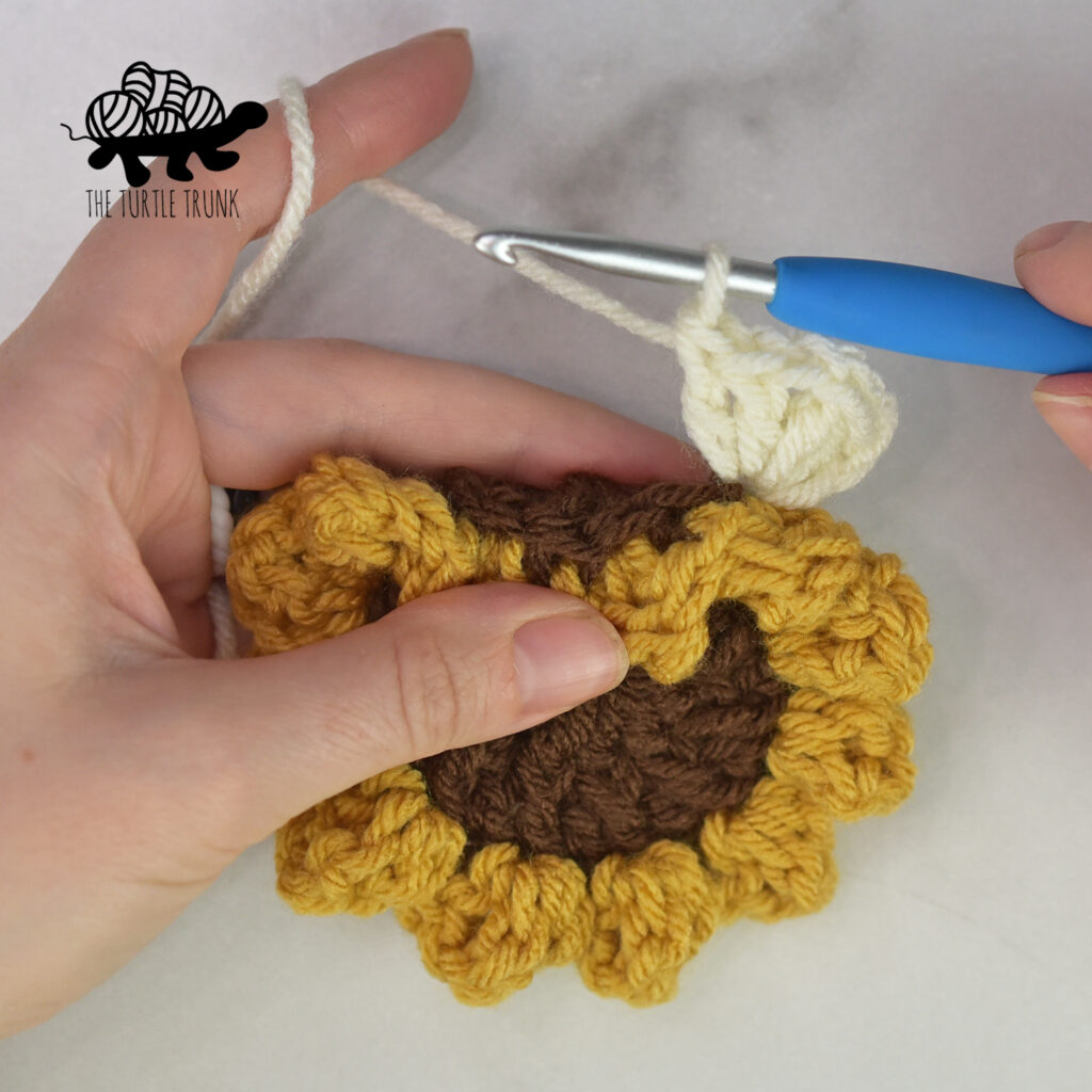 Shows the first corner for the square on the Sunflower Square crochet pattern.