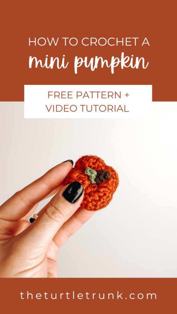 Pinterest pin for the Mini Pumpkin crochet pattern by The Turtle Trunk. Photo shows a hand holding a mini crochet pumpkin.