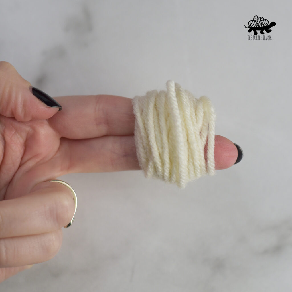 How to make a mini pom pom.