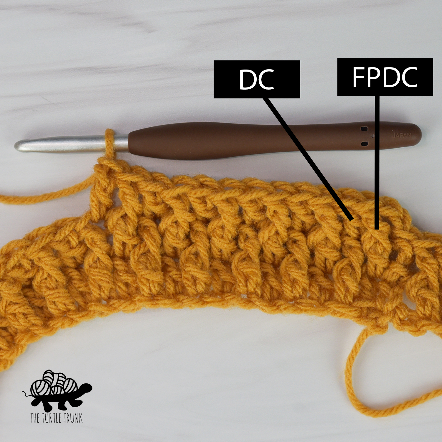 Photo shows yellow yarn and crochet hook working a row of front post double crochet stitches and double crochet stitches alternating.