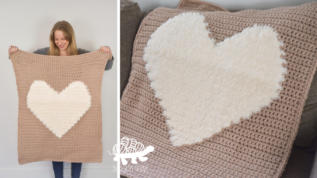 Photo shows a woman holding up a crochet heart blanket and the crochet heart blanket laying on a couch. Crochet pattern is the Love to Cuddle Blanket by The Turtle Trunk.