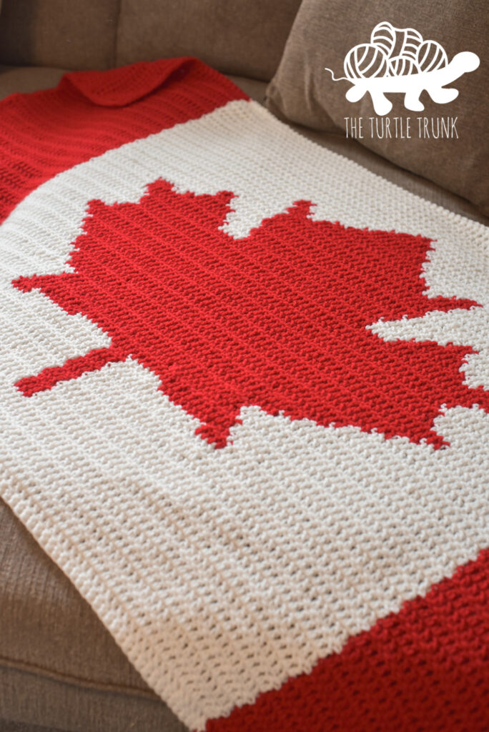 Closeup of a crochet Canadian Flag Blanket.