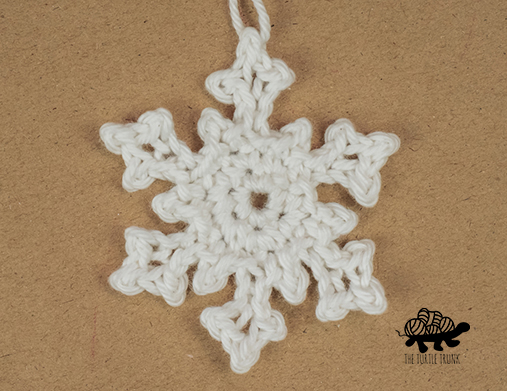 a crochet snowflake applique.