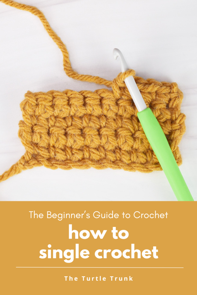 How to single crochet. Photo shows a small, crochet swatch mad cup of single crochet stitches wit yellow yarn and a green crochet hook.