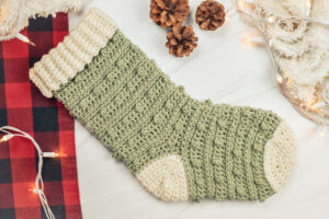 Green and white crochet Christmas stocking.