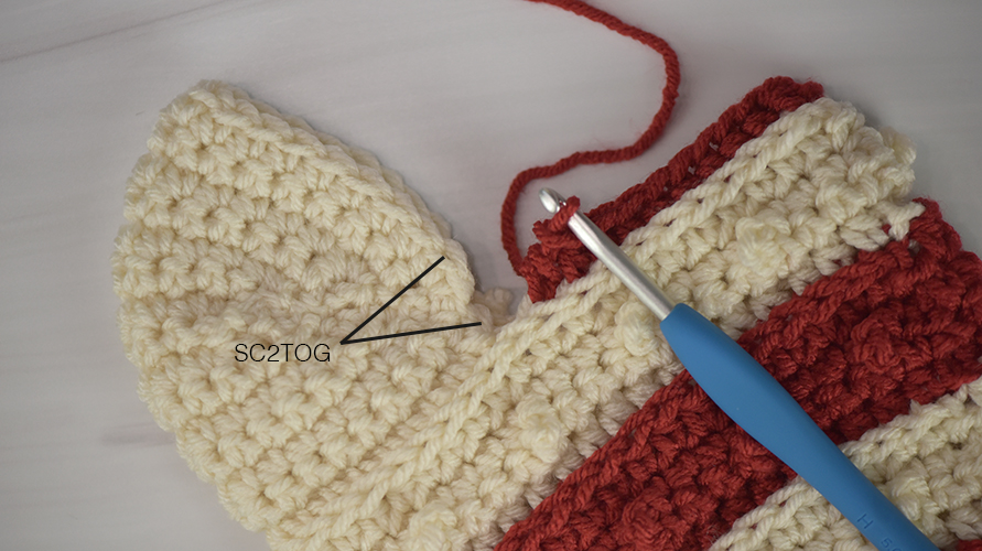 Single crochet 2 together to join the heel to the body.