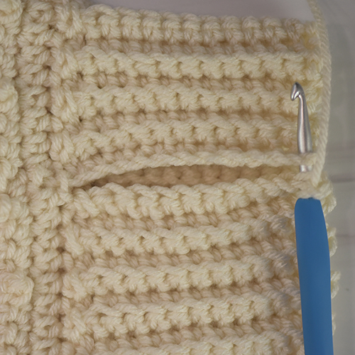 Seaming the ends of the cuff.