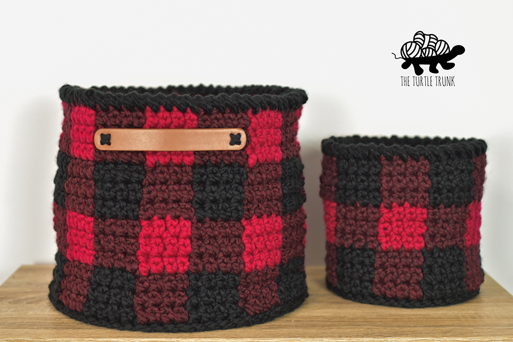 2 plaid crochet baskets.