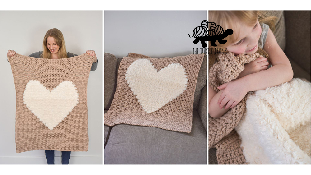 Crochet blanket with a heart on it.