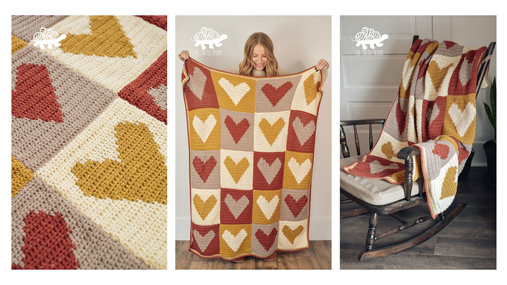 Woman holding a crochet heart blanket.