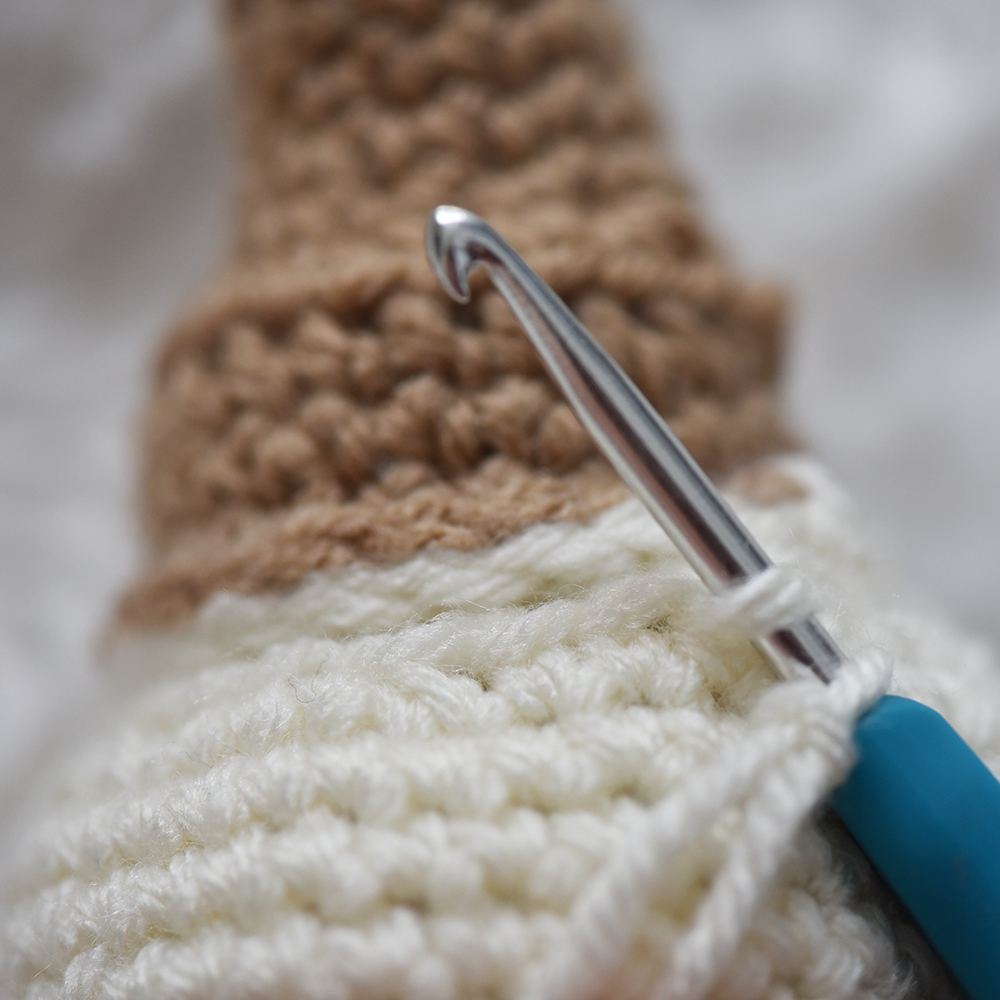 Close up of adding the ruffles to the crochet amigurumi ice cream.
