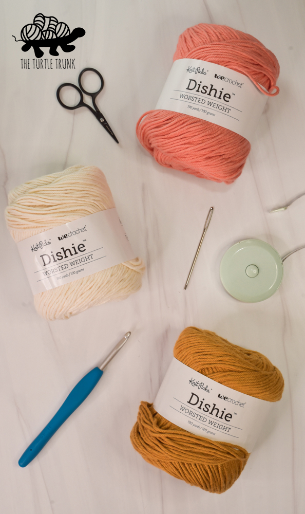 Photo shows 3 skeins of dish yarn on a white surface.