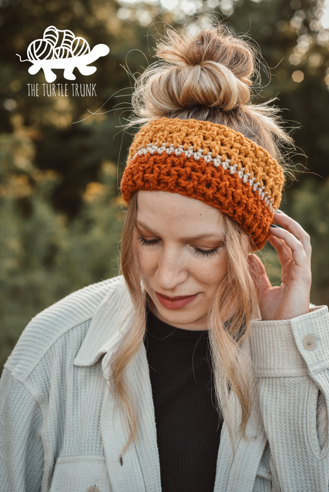 Woman wearing a crochet headband.