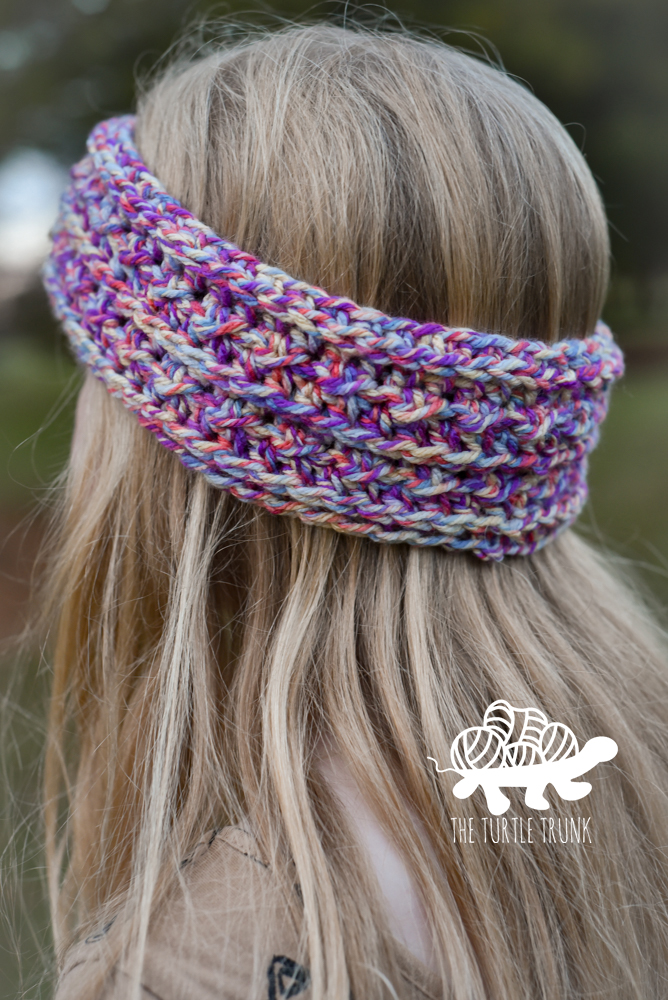 Girl wearing a crochet headband.