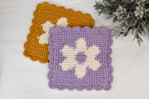 A crochet flower dishcloth.