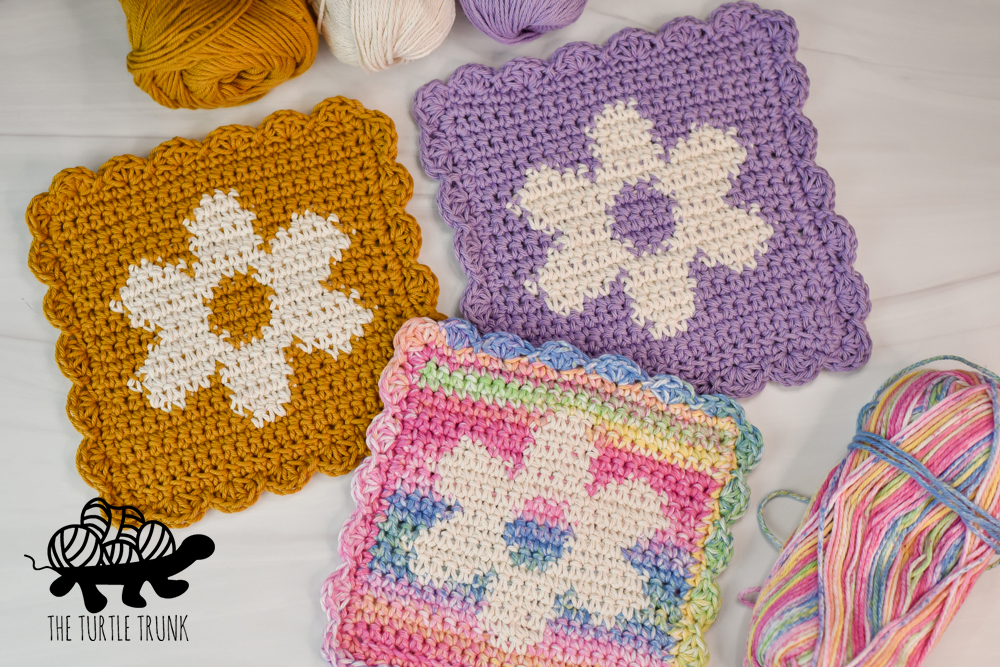 3 crochet dishcloths with flower designs not hem. Flower Dishcloth crochet pattern by The Turtle Trunk.